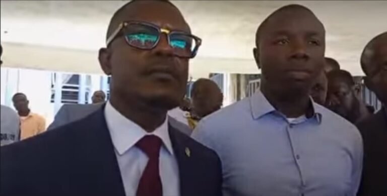Monrovia Mayor Jefferson Koijee (Right) with lawyer at the headquarters of the Liberia National Police Wednesday Photo: FPA
